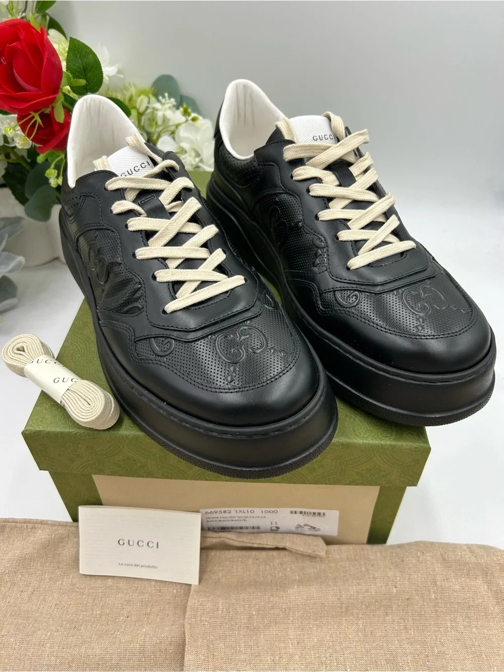 Men's Gucci, GG embossed, black leather sneakers size 11 fits 11.5 made in Italy